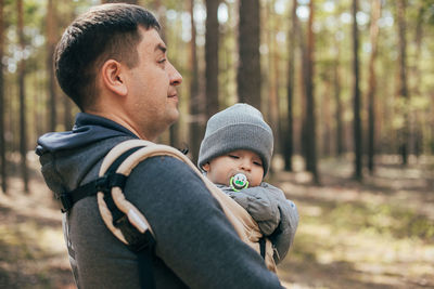 Full length of father and daughter in forest