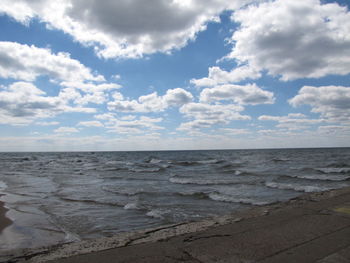 Scenic view of sea against cloudy sky