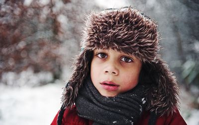 Close-up portrait of boy in snow