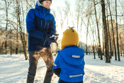 Man standing on snow covered field