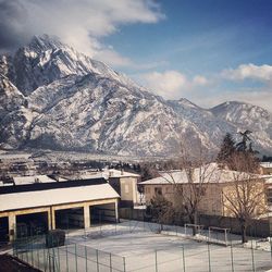 Scenic view of snow covered mountains against sky