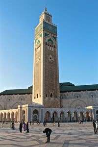 Low angle view of mosque hassan ii against sky