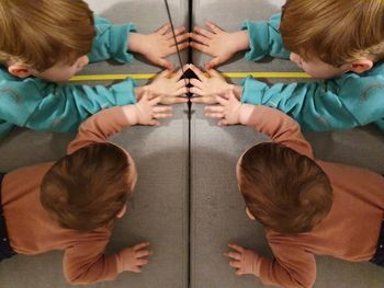 High angle view of people sitting on floor