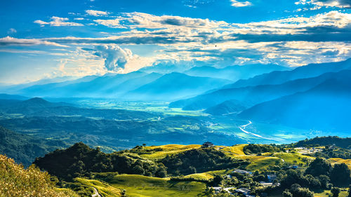 Aerial view of landscape and mountains against sky