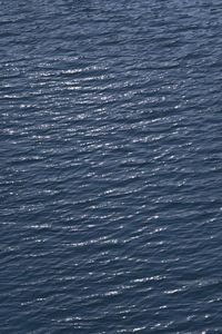 Full frame shot of rippled sea against sky