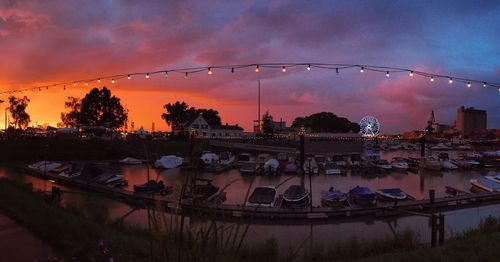 View of ferris wheel against dramatic sky