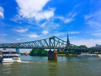 View of bridge over river against sky