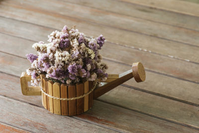 Close-up of pink flowering plant on table