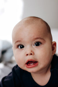 Portrait of sweet funny baby with chubby cheeks