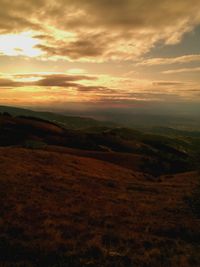 Scenic view of landscape against sky during sunset