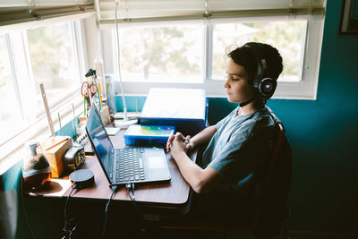 Boy sits at his desk for the first day of virtual school