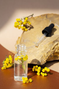 Close-up of yellow flowers on table