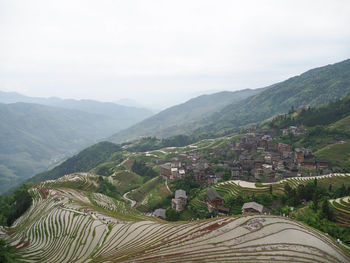 Scenic view of agricultural landscape against sky