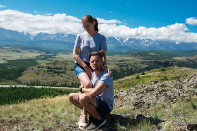 Full length of a young man on mountain against sky