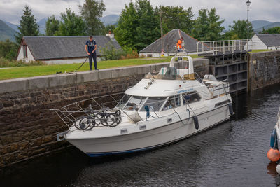 Man on boat moored at shore