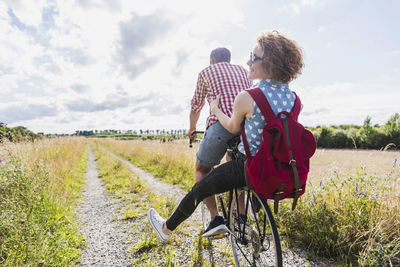 Happy young couple on a bicycle tour