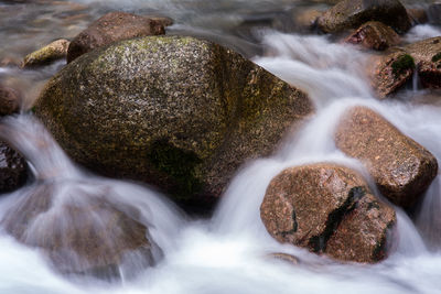 Close-up of water flowing through rocks