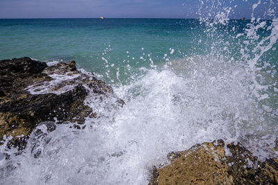 Sea waves splashing on rocks