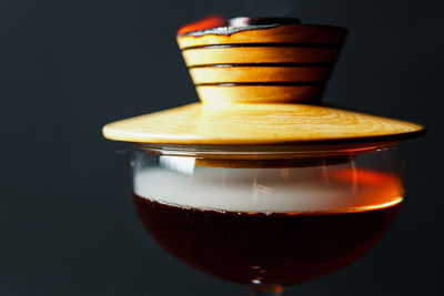 Close-up of drink against black background