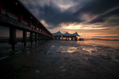 Scenic view of beach against sky during sunset