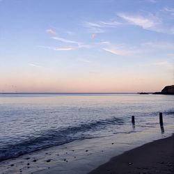 Scenic view of beach against blue sky