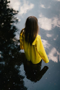 Rear view of woman in water