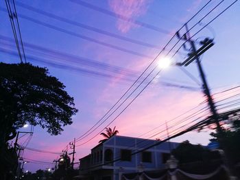 Low angle view of electricity pylon against sky