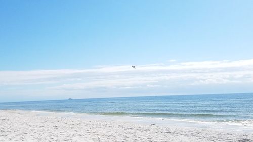 Scenic view of sea against blue sky