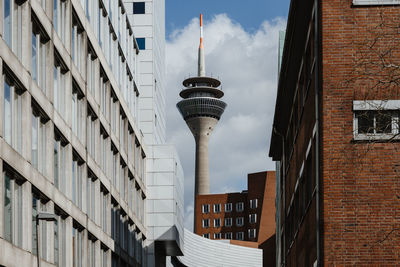 Outdoor sunny street views among exterior facades of corporate buildings.