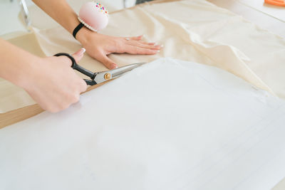 Midsection of doctor examining patient in hospital