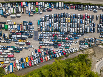 Aerial view of colorful cars parked on parking lot