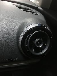 Close-up of car on road