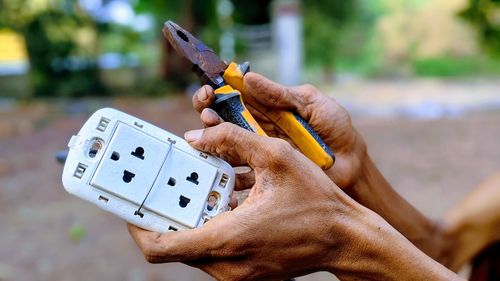 Close-up of man playing guitar