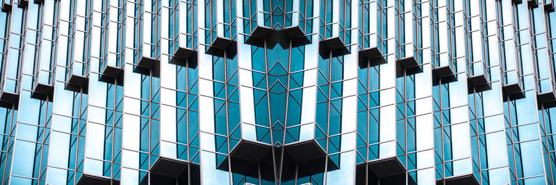 Digital composite image of modern glass building