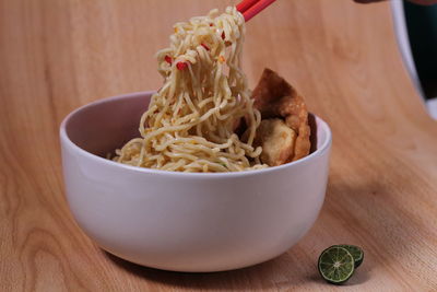 Close-up of rice in bowl on table