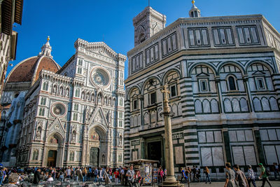 People outside duomo santa maria del fiore in city