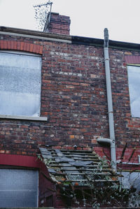 Low angle view of old building against clear sky