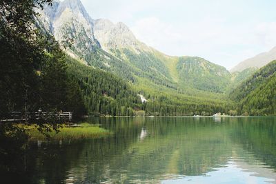 Scenic view of lake and mountains against sky