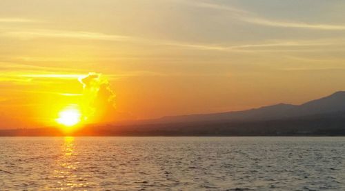 Scenic view of sea at sunset