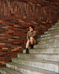 A portrait of a young girl sitting on the stairs 