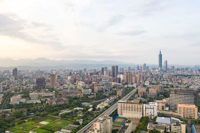 High angle view of buildings in city against sky