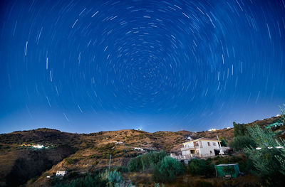 Scenic view of mountain against sky at night