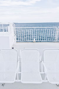 White chairs on boat deck