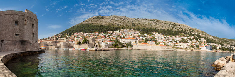 Mediterranean panorama of the beautiful dubrovnik old city,  old port, city walls and fortifications