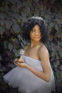 Portrait of young woman with a light