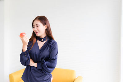 Woman standing against wall