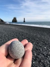 Close-up of hand holding sand