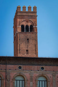 Torre dell arengo in the italian city of bologna on a summer morning