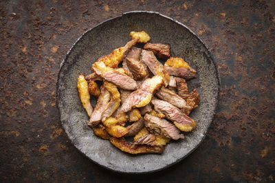 High angle view of meat in cooking pan