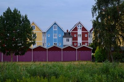 Scandinavian style house on field against sky